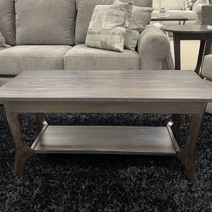 Wood coffee table in living room with couches