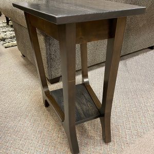 Wooden side table with dark finish and lower shelf.