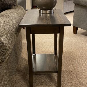 Wooden side table with vase in living room.