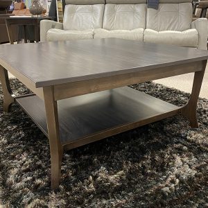 Dark wooden coffee table on shaggy rug