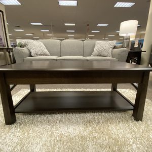 Contemporary living room with gray sofa and coffee table.