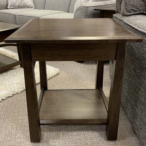 Wooden side table in living room setting.
