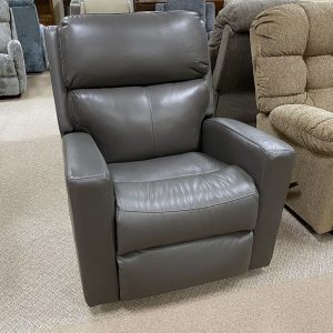 Gray leather recliner in a furniture store display.