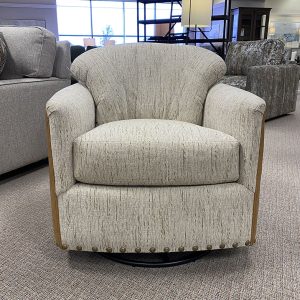 Comfortable beige swivel chair in a showroom.