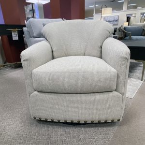 Gray upholstered armchair in furniture showroom