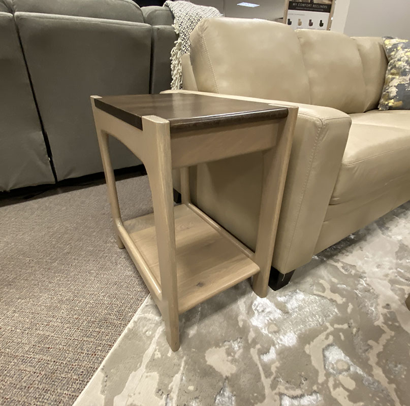 Wooden side table beside beige sofa