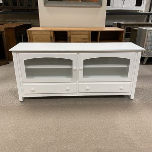 White wooden cabinet with glass doors and drawers.