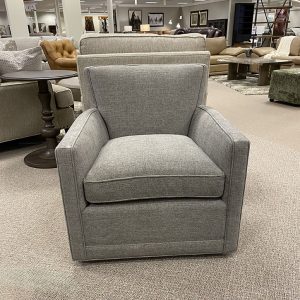 Gray armchair in furniture store showroom