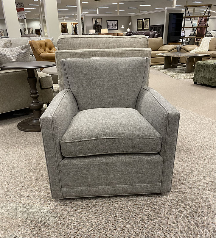 Gray armchair in furniture store showroom