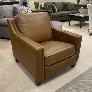 Brown leather armchair in furniture store display.