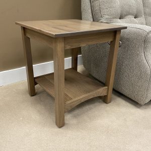 Wooden side table beside gray sofa.