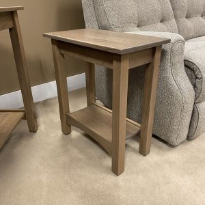Wooden side table next to gray sofa.