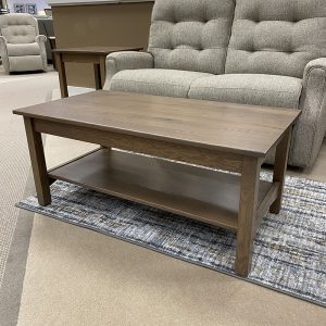 Wooden coffee table in living room setting.