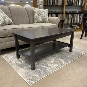 Modern wood coffee table in furniture showroom.