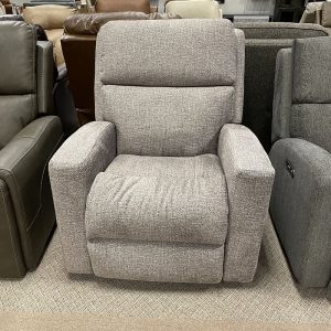 Gray recliner chair in furniture store showroom.