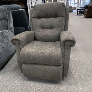 Gray fabric recliner chair in furniture showroom.