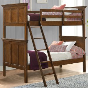 Wooden bunk beds with ladder and pillows.