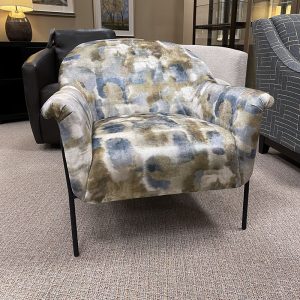 Patterned armchair with abstract design in showroom.