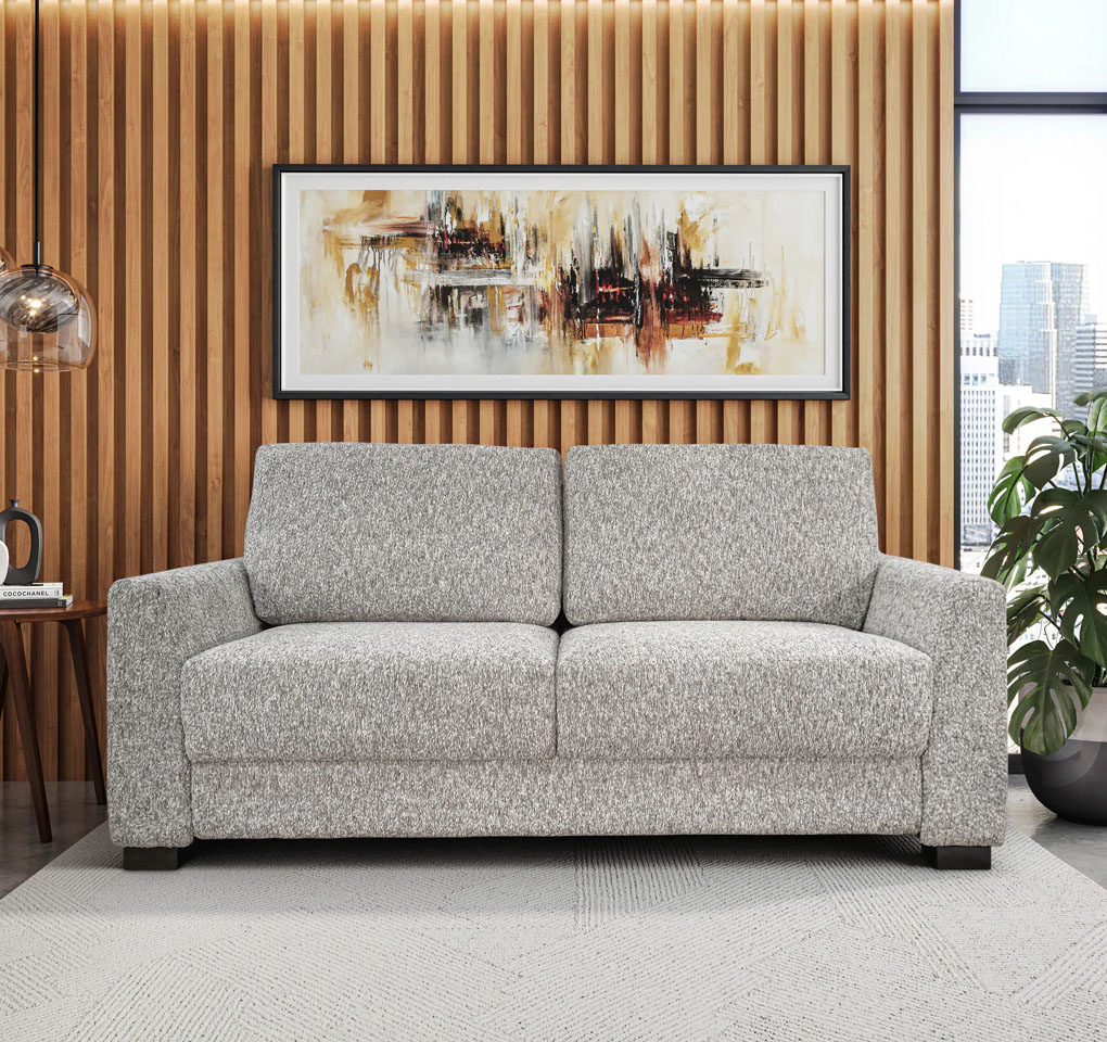 Modern gray sofa with abstract art on wall.