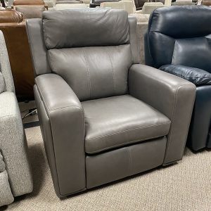 Gray leather armchair in furniture store.