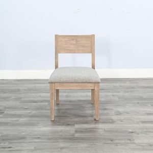 Wooden chair with cushioned seat on gray floor.