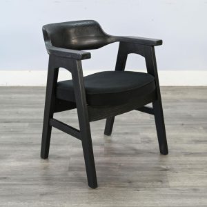 Modern black wooden chair on grey floor
