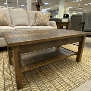 Wooden coffee table in cozy living room setting.