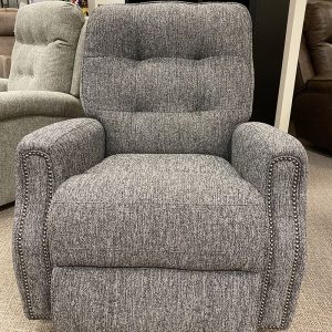 Gray recliner chair in furniture store showroom.