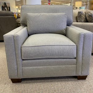 Gray modern armchair in furniture showroom