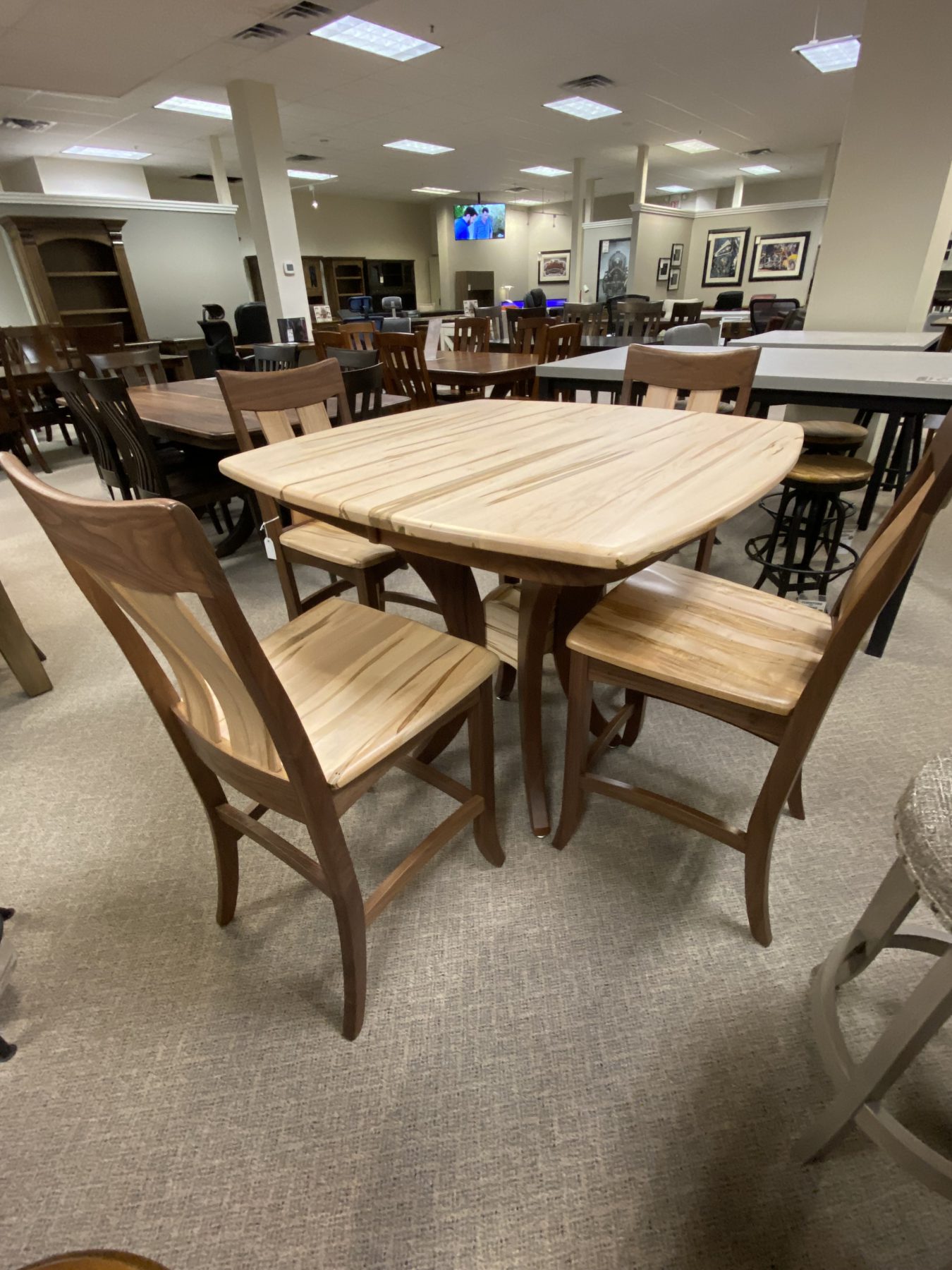 Wooden dining table set in furniture store.